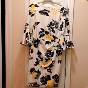 New, white dress, with black and yellow flowers